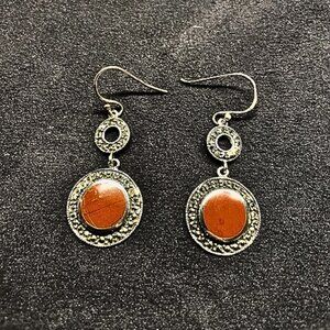 Beautiful Coral surrounded by 925 Silver and Hematite.